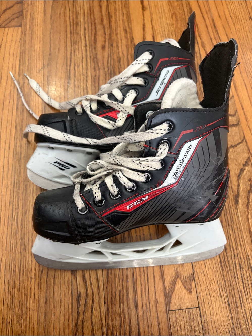 HOCKEY SKATES. CCM Brand Kids Black and Red Water Hockey skates